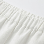 Dames tweedelige set bestaande uit een blouse met lange mouwen en een short met ruches.