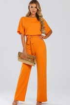 Caelia | Jumpsuit Dames - Wijde Pijpen Ceintuur Oranje